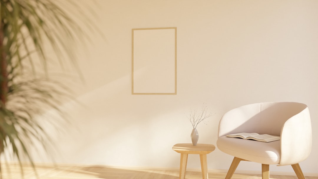A calm, sunlit corner of the practice with a soft armchair, a plant, and an open book.