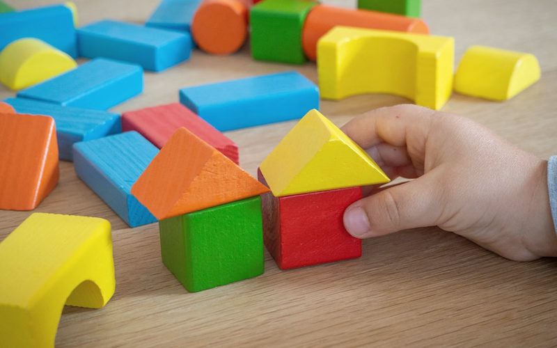 Colourful wooden building blocks.